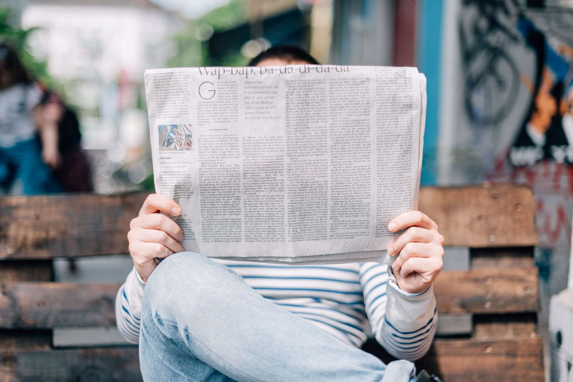 Person Reading News. Sustainability Recap 2023.